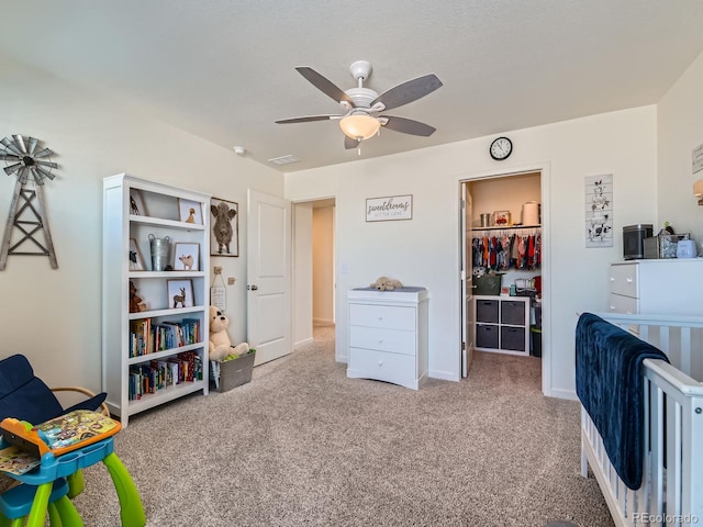 rec room featuring carpet flooring and ceiling fan