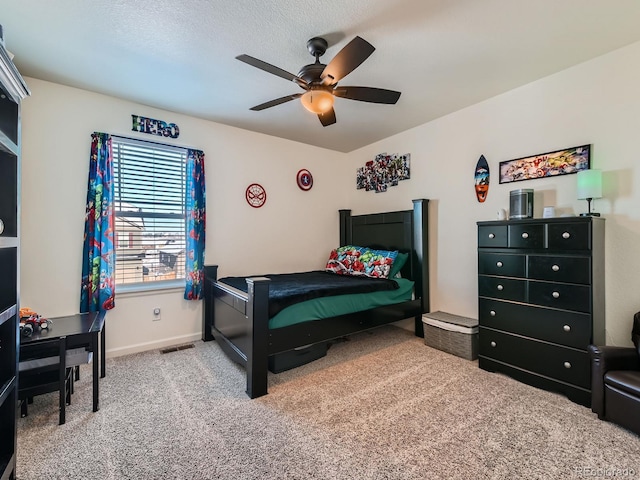 carpeted bedroom with ceiling fan