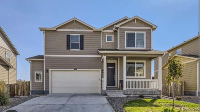 2300 Mountain Sky Dr, Fort Lupton, CO 80621 - craftsman-style house featuring a porch, a garage, and concrete driveway