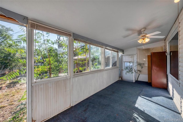 unfurnished sunroom featuring lofted ceiling and ceiling fan