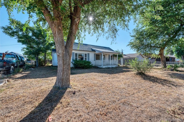 ranch-style home featuring covered porch