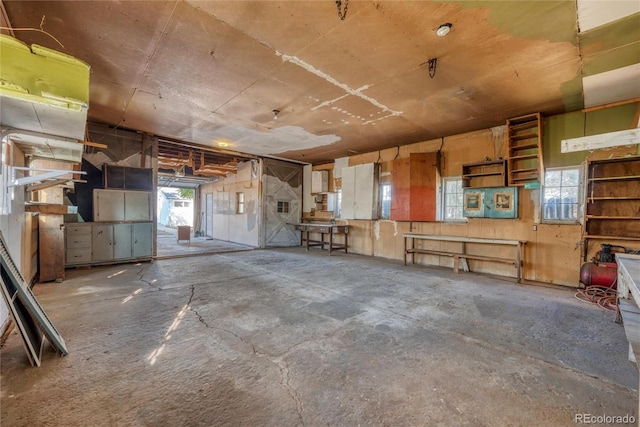 miscellaneous room with concrete flooring and a wealth of natural light