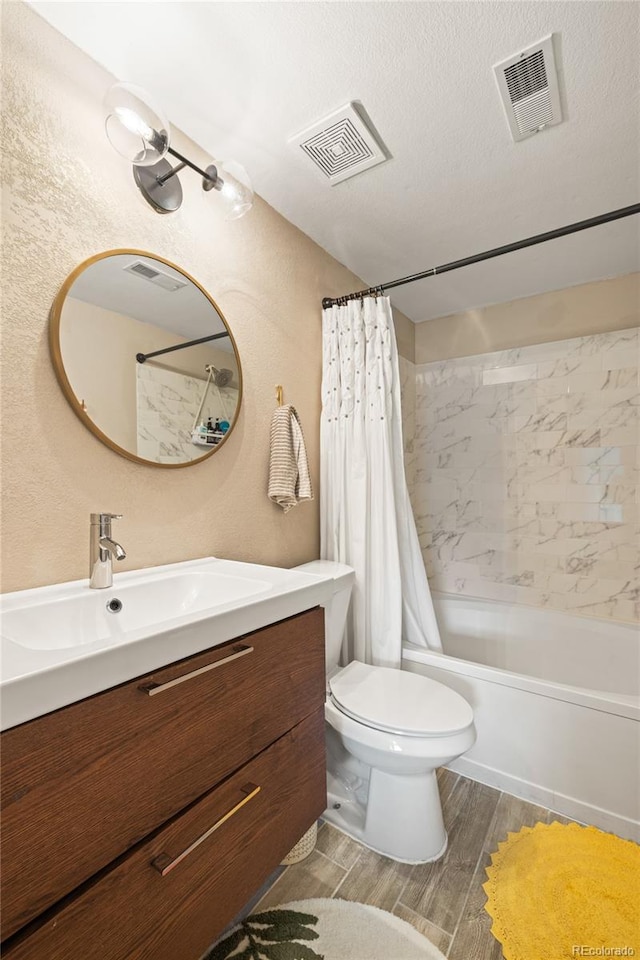 7452 Singing Hills Dr, Boulder, CO 80301 - full bathroom with vanity, shower / bath combo, toilet, and wood finished floors