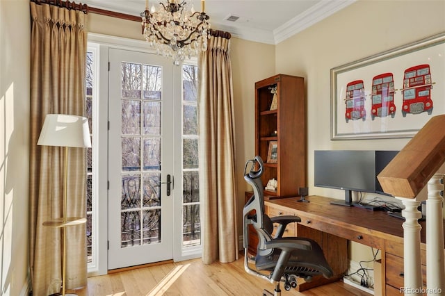 office featuring a notable chandelier, wood finished floors, visible vents, and crown molding