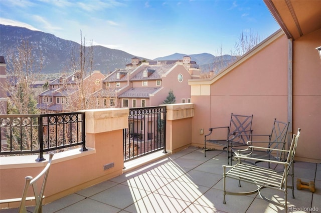 balcony with a residential view and a mountain view