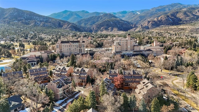 birds eye view of property featuring a mountain view