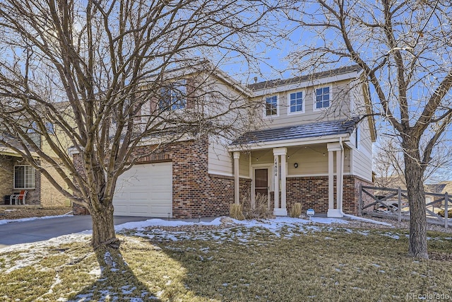 view of property featuring a yard and a garage