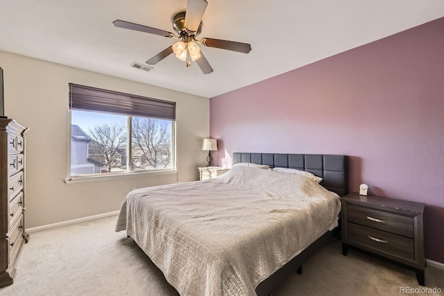 bedroom featuring ceiling fan and light colored carpet