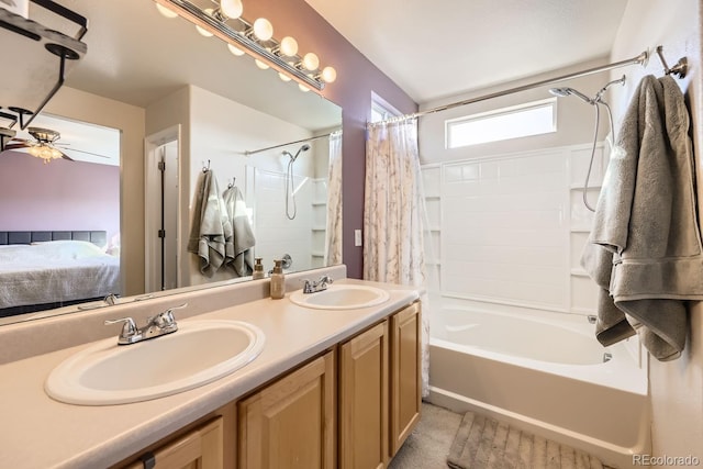 bathroom with ceiling fan, vanity, and shower / tub combo