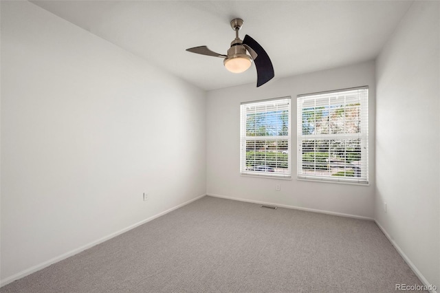 1011 Pierce St Unit 11, Lakewood, CO 80214 - spare room featuring ceiling fan, light colored carpet, and baseboards