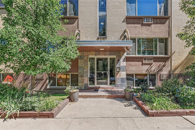 10 N Ogden St Unit 5, Denver, CO 80218 - doorway to property featuring brick siding
