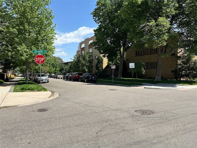 10 N Ogden St Unit 5, Denver, CO 80218 - view of asphalt street with traffic signs, sidewalks, and curbs