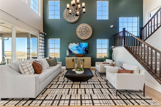 living room with hardwood / wood-style floors and a chandelier