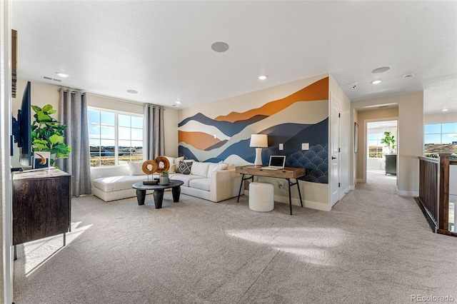 living room featuring light carpet, vaulted ceiling, and a healthy amount of sunlight