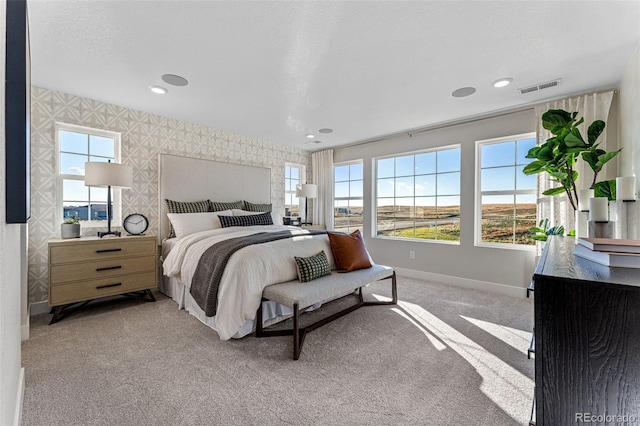 carpeted bedroom featuring a textured ceiling