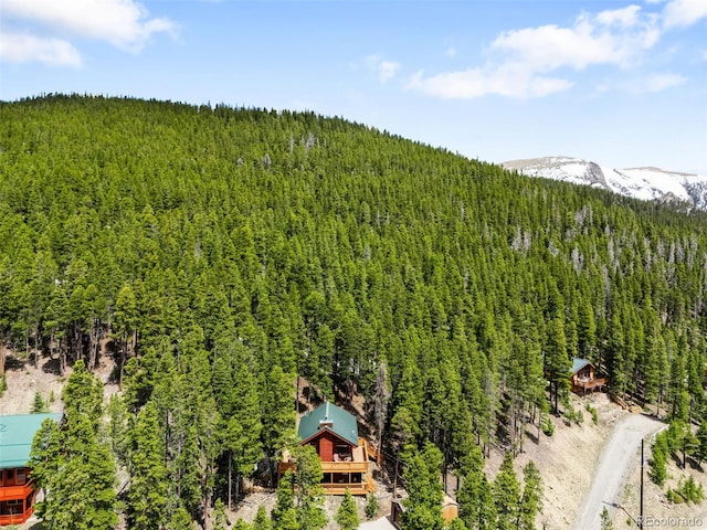 489 Harris Dr, Idaho Springs, CO 80452 - aerial view of property and surrounding area with a forest and a mountain backdrop