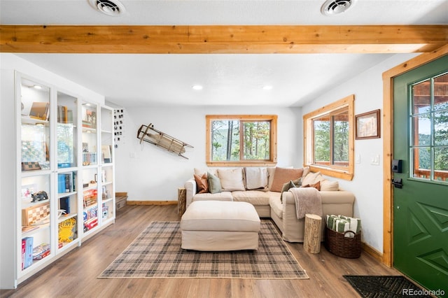489 Harris Dr, Idaho Springs, CO 80452 - living room with healthy amount of natural light, baseboards, wood finished floors, and recessed lighting