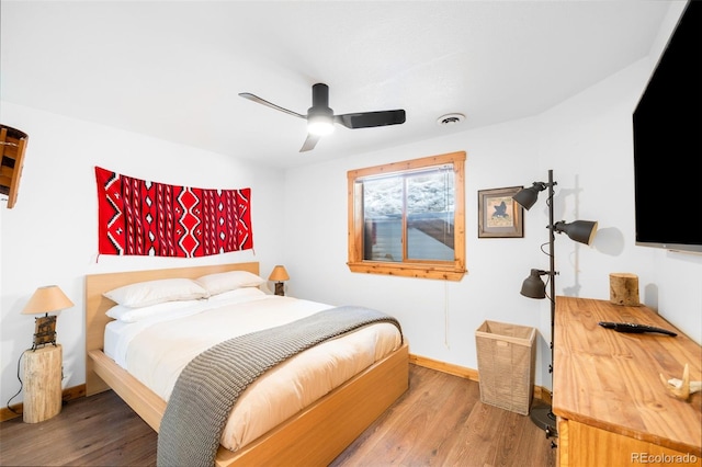 489 Harris Dr, Idaho Springs, CO 80452 - bedroom with wood finished floors, baseboards, and a ceiling fan