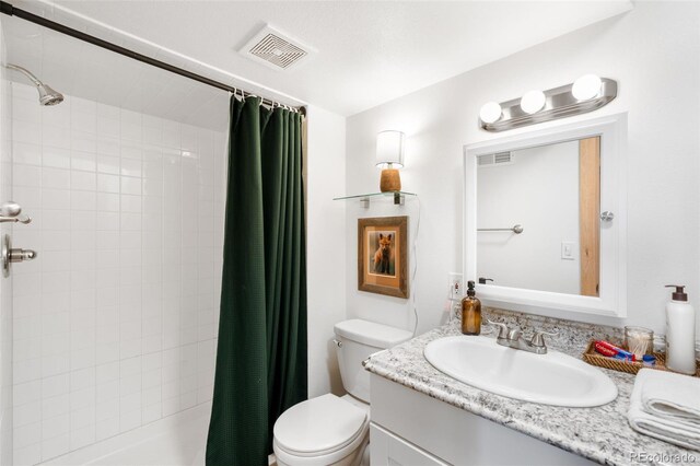 489 Harris Dr, Idaho Springs, CO 80452 - full bath with vanity, toilet, and shower / tub combo
