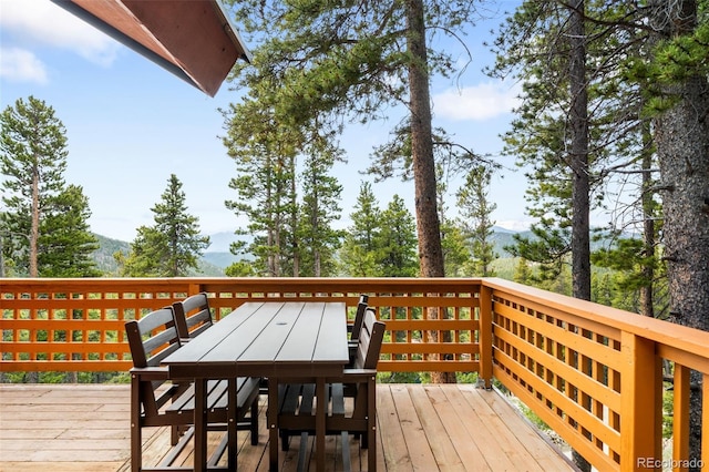 489 Harris Dr, Idaho Springs, CO 80452 - deck with outdoor dining area and a mountain view
