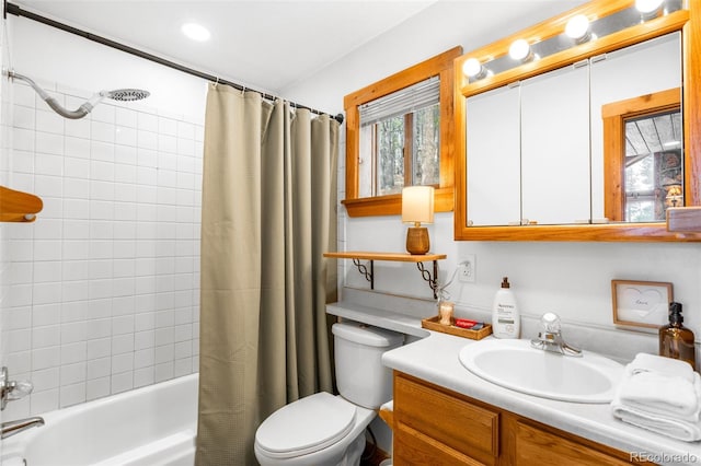 489 Harris Dr, Idaho Springs, CO 80452 - bathroom featuring vanity, toilet, and shower / bath combination with curtain
