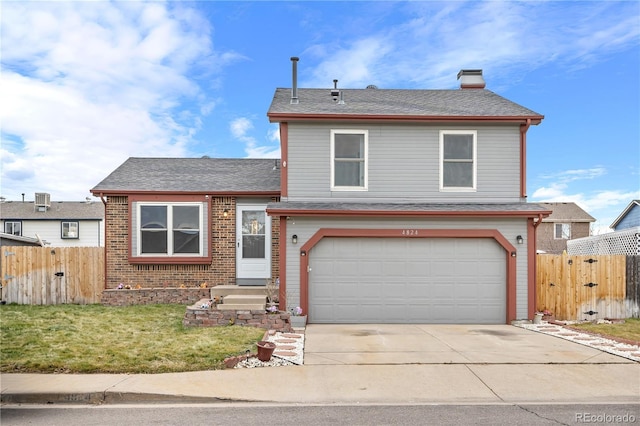 view of front of property with a front lawn and a garage