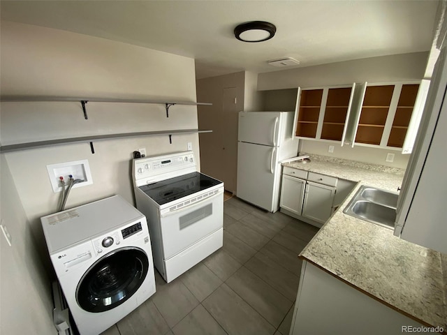 kitchen featuring white appliances, washer / clothes dryer, and sink