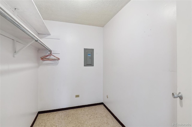 spacious closet featuring electric panel