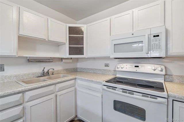 495 S Dayton St Unit 10C, Denver, CO 80247 - kitchen with white cabinets, white appliances, and a sink