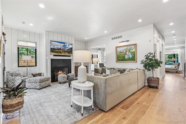 living room with light hardwood / wood-style flooring