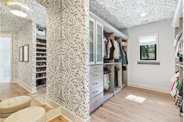 walk in closet featuring light wood-type flooring