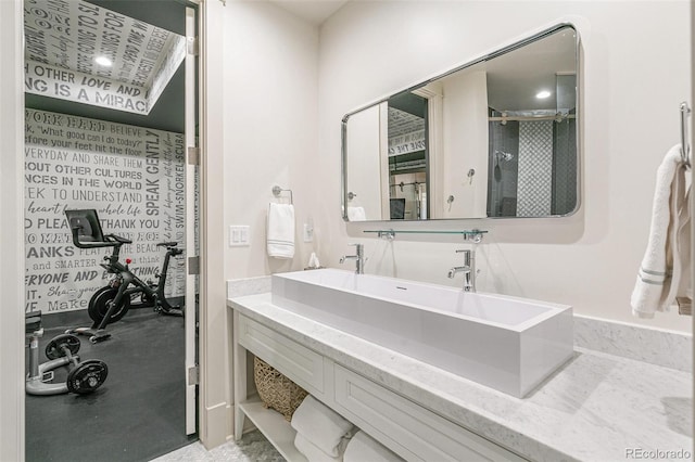 bathroom with an enclosed shower and vanity