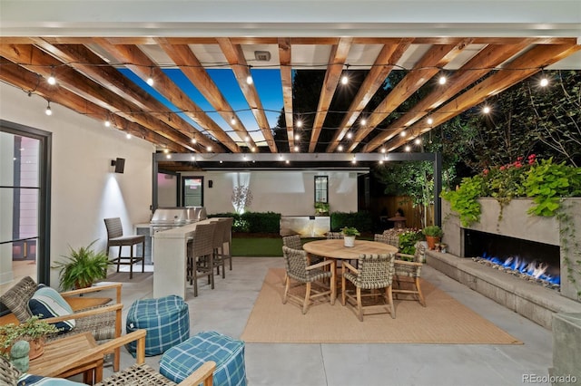 view of patio / terrace with a pergola and exterior kitchen