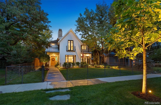 view of front of house with a lawn