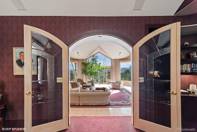 interior space with french doors and lofted ceiling