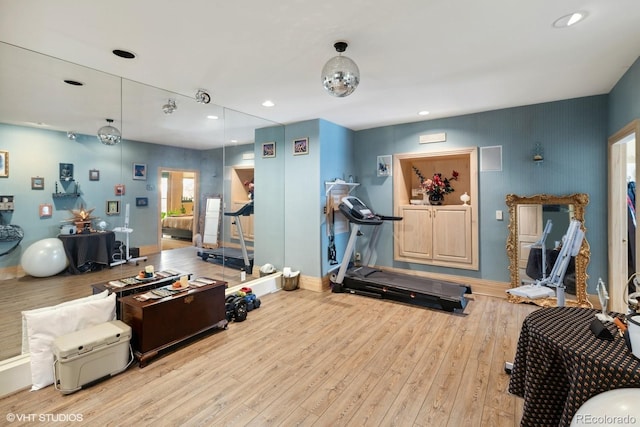 workout room with light wood-type flooring