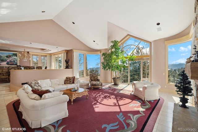 tiled living room with high vaulted ceiling and a notable chandelier