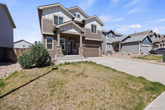6154 Fiddle Way, Colorado Springs, CO 80925 - craftsman inspired home with board and batten siding, an attached garage, concrete driveway, a residential view, and stone siding