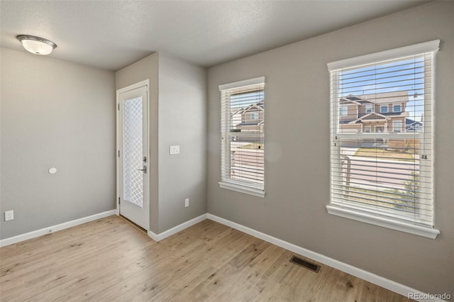 6154 Fiddle Way, Colorado Springs, CO 80925 - spare room featuring light wood-style flooring and baseboards