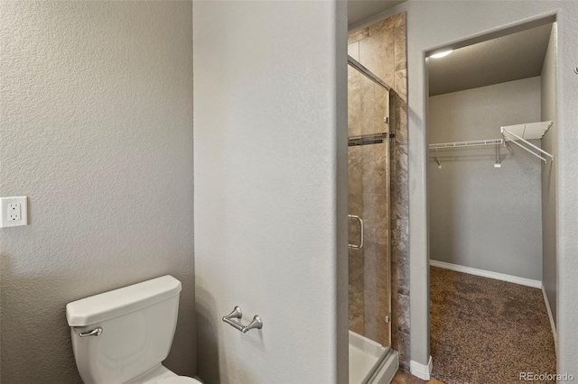 6154 Fiddle Way, Colorado Springs, CO 80925 - bathroom with a shower stall and a walk in closet