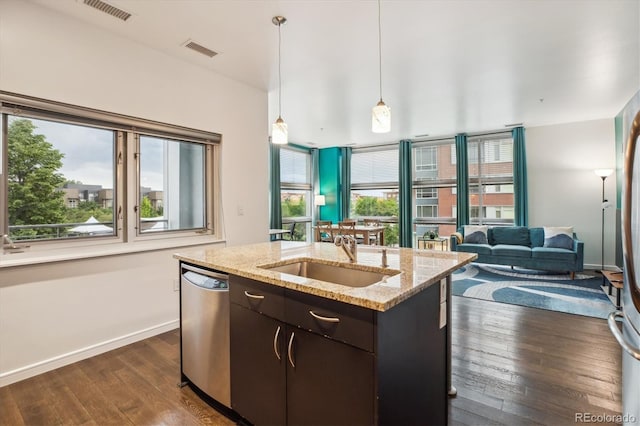 2958 Syracuse St Unit 317, Denver, CO 80238 - kitchen featuring dishwasher, dark wood-style floors, plenty of natural light, and open floor plan