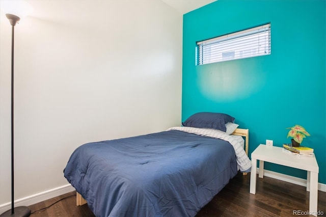 2958 Syracuse St Unit 317, Denver, CO 80238 - bedroom featuring wood finished floors and baseboards