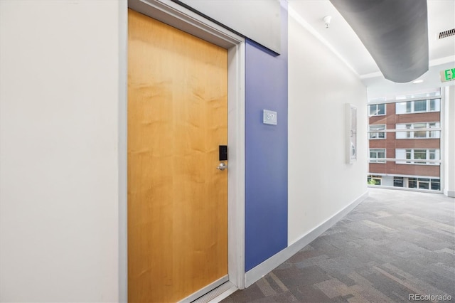 2958 Syracuse St Unit 317, Denver, CO 80238 - corridor featuring carpet floors and baseboards