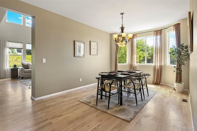 2815 Dreamcatcher Loop, Castle Rock, CO 80109 - dining area featuring a chandelier and light wood-style floors