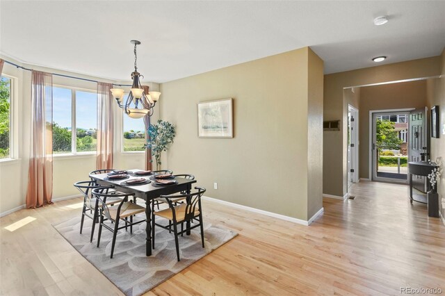 2815 Dreamcatcher Loop, Castle Rock, CO 80109 - dining room featuring a chandelier and light wood-style flooring