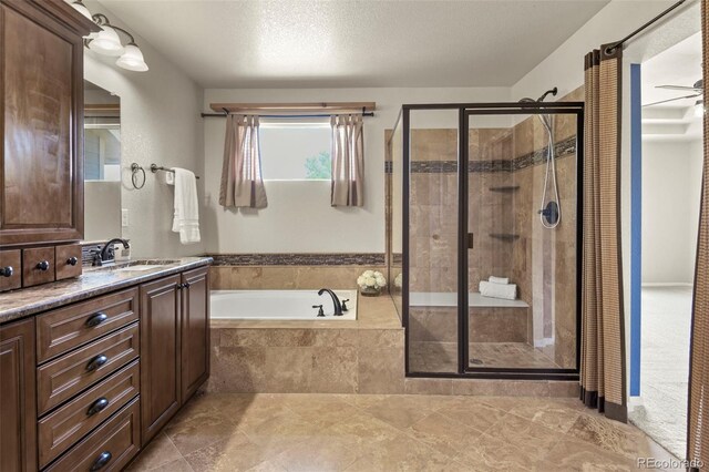 2815 Dreamcatcher Loop, Castle Rock, CO 80109 - full bathroom featuring a garden tub, a stall shower, and vanity