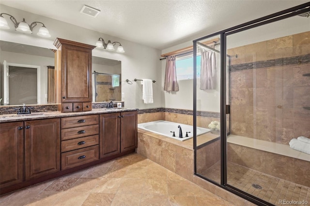 2815 Dreamcatcher Loop, Castle Rock, CO 80109 - bathroom with a stall shower, a bath, and double vanity