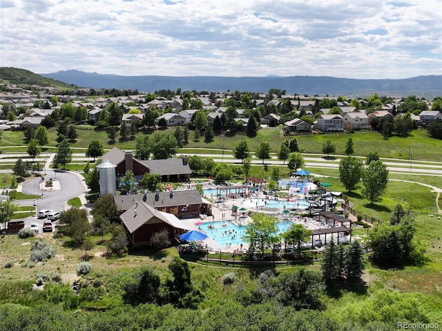 2815 Dreamcatcher Loop, Castle Rock, CO 80109 - aerial view of residential area with a pool area and mountains