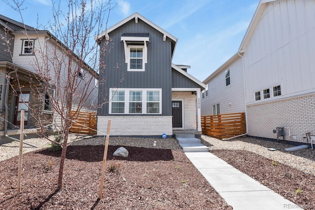 23920 E 34th Ave, Aurora, CO 80019 - view of front of home featuring brick siding and board and batten siding