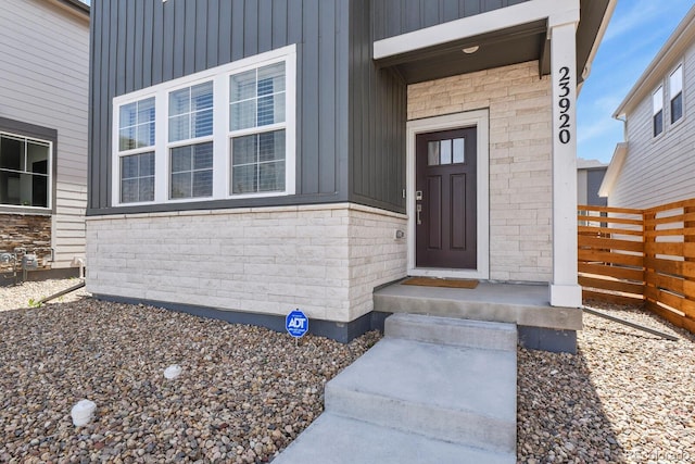 23920 E 34th Ave, Aurora, CO 80019 - view of exterior entry featuring board and batten siding